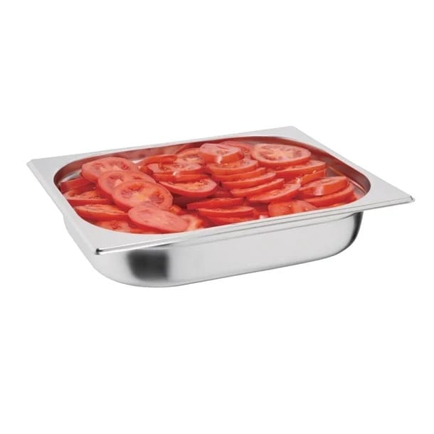 Stainless steel tray filled with sliced tomatoes